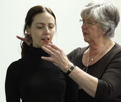 Janice adjusting singer's head and neck posture